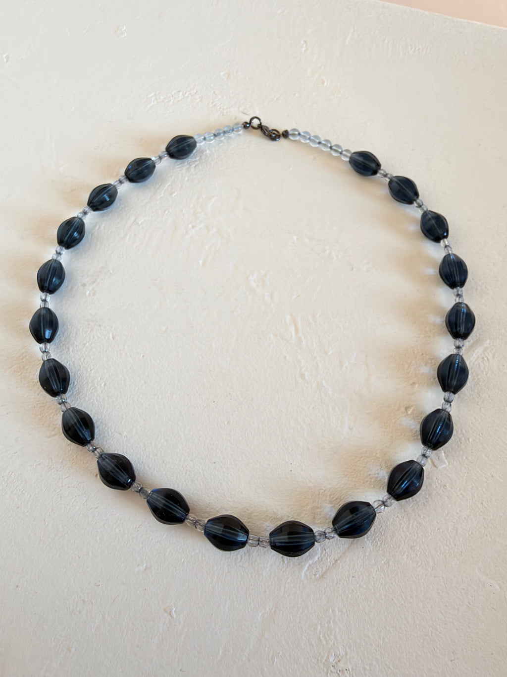 Deep blue faceted oval glass necklace